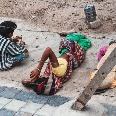 back-view-of-three-children-lying-on-floor-outdoor.jpg